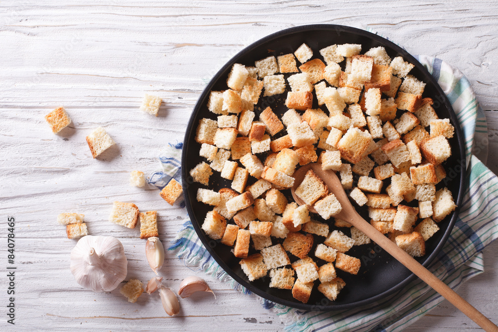 Homemade croutons in a bowl horizontal view top
 - obrazy, fototapety, plakaty 