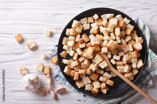 Homemade croutons in a bowl horizontal view top
 photo