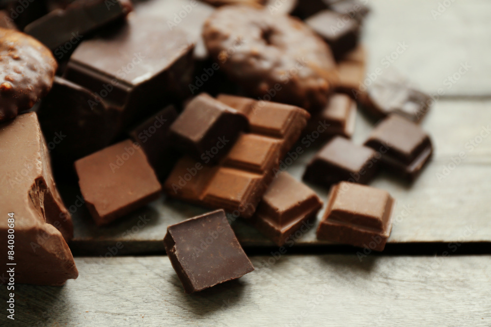 Set of chocolate on wooden table, closeup Set of chocolate on wooden table, closeup