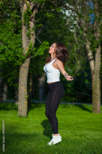 Sport, activity. Cute woman with skipping rope