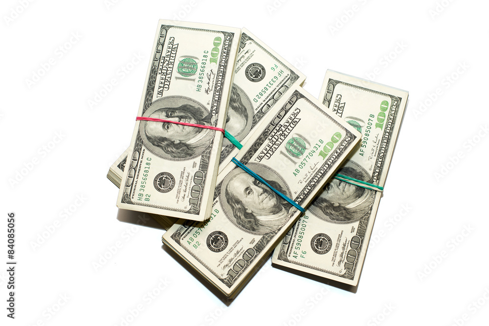 Bundles of US dollars banknotes on a white background Bundles of US dollars banknotes on a white background