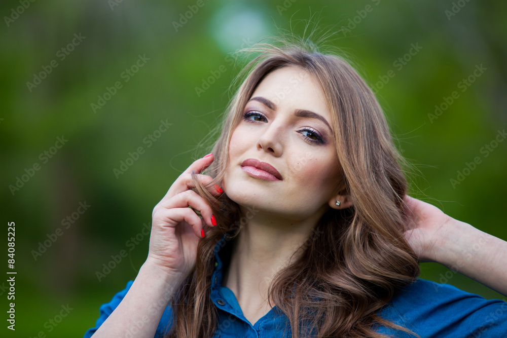 portrait of a beautiful blonde outdoors in the park