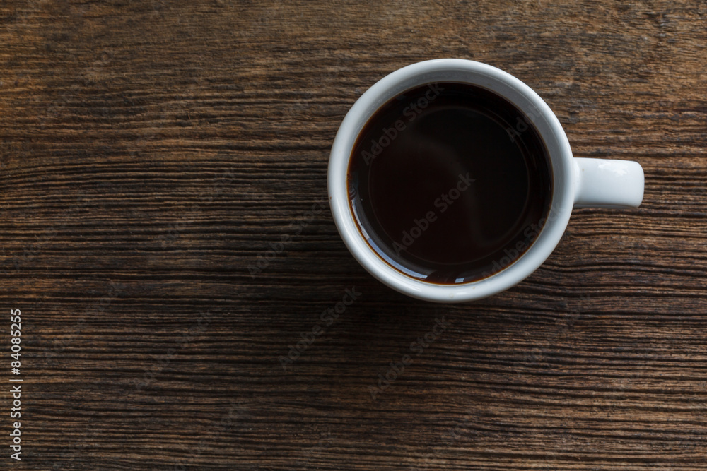 Top view of coffee cup on wooden