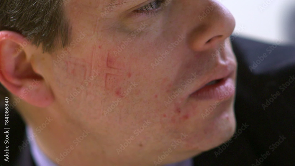 Young Business Executive Man Sleeping At Desk In Office wakes up with keyboard key impressions on his face Young Business Executive Man Sleeping At Desk In Office wakes up with keyboard key impressions on his face