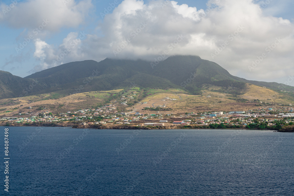 Colorful Homes Under Cloudy St Kitts Mountain