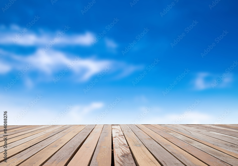 white fluffy clouds with rainbow in the blue sky