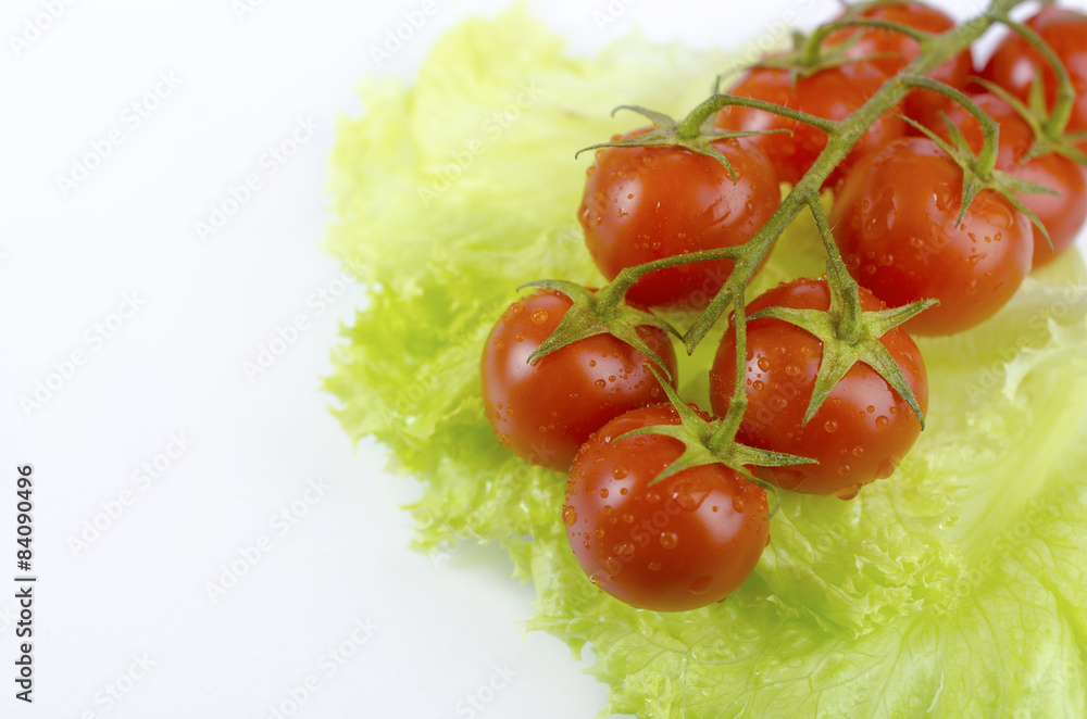 Red tomatoes and green salad leaf Red tomatoes and green salad leaf