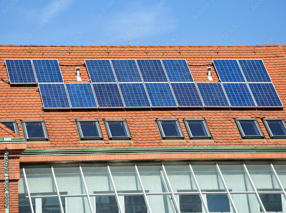 Fototapeta premium Solar panels on the roof of the school building