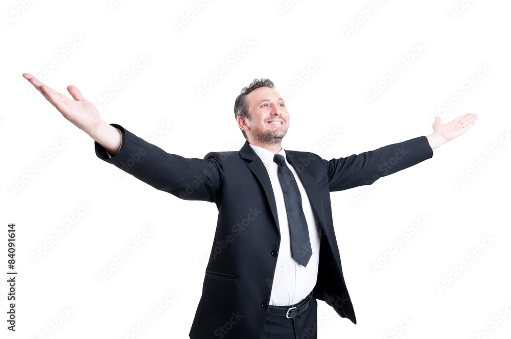 Very successful business man stretching arms wide open Very successful business man stretching arms wide open