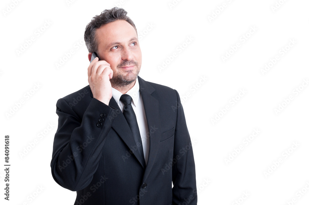 Confident business manager talking on the phone Confident business manager talking on the phone