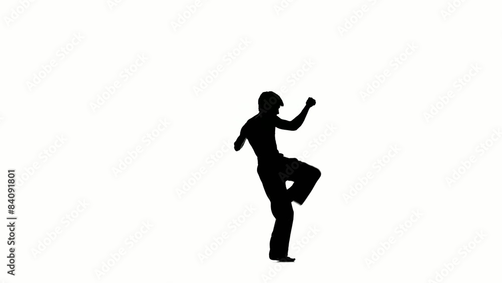 Karate or taekwondo makes several hops around you, Silhouette Karate or taekwondo makes several hops around you, Silhouette