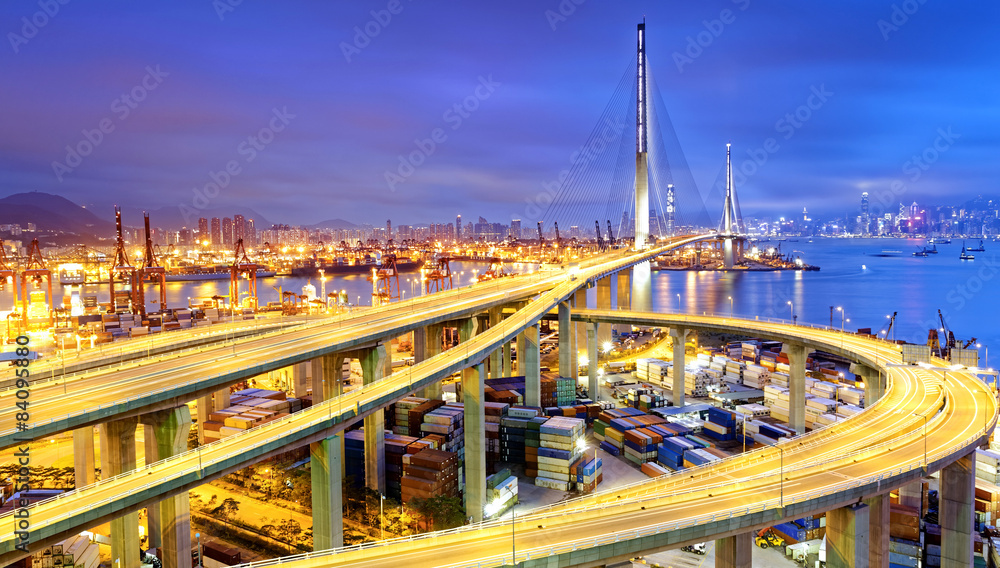 Fototapeta premium Container Cargo freight ship with working crane bridge in shipya