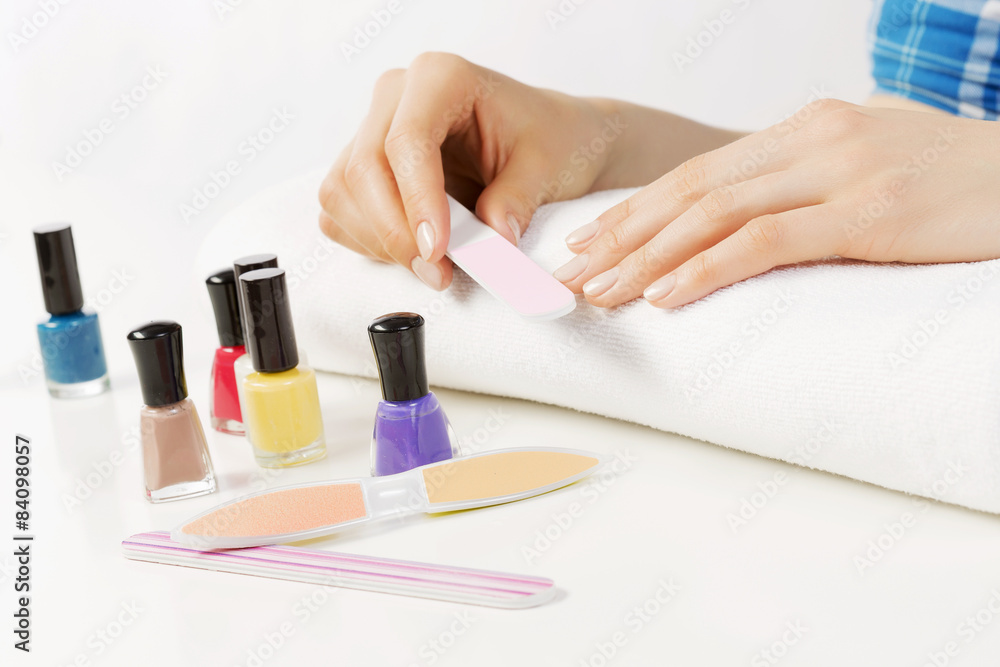 Woman using nailfile Woman using nailfile