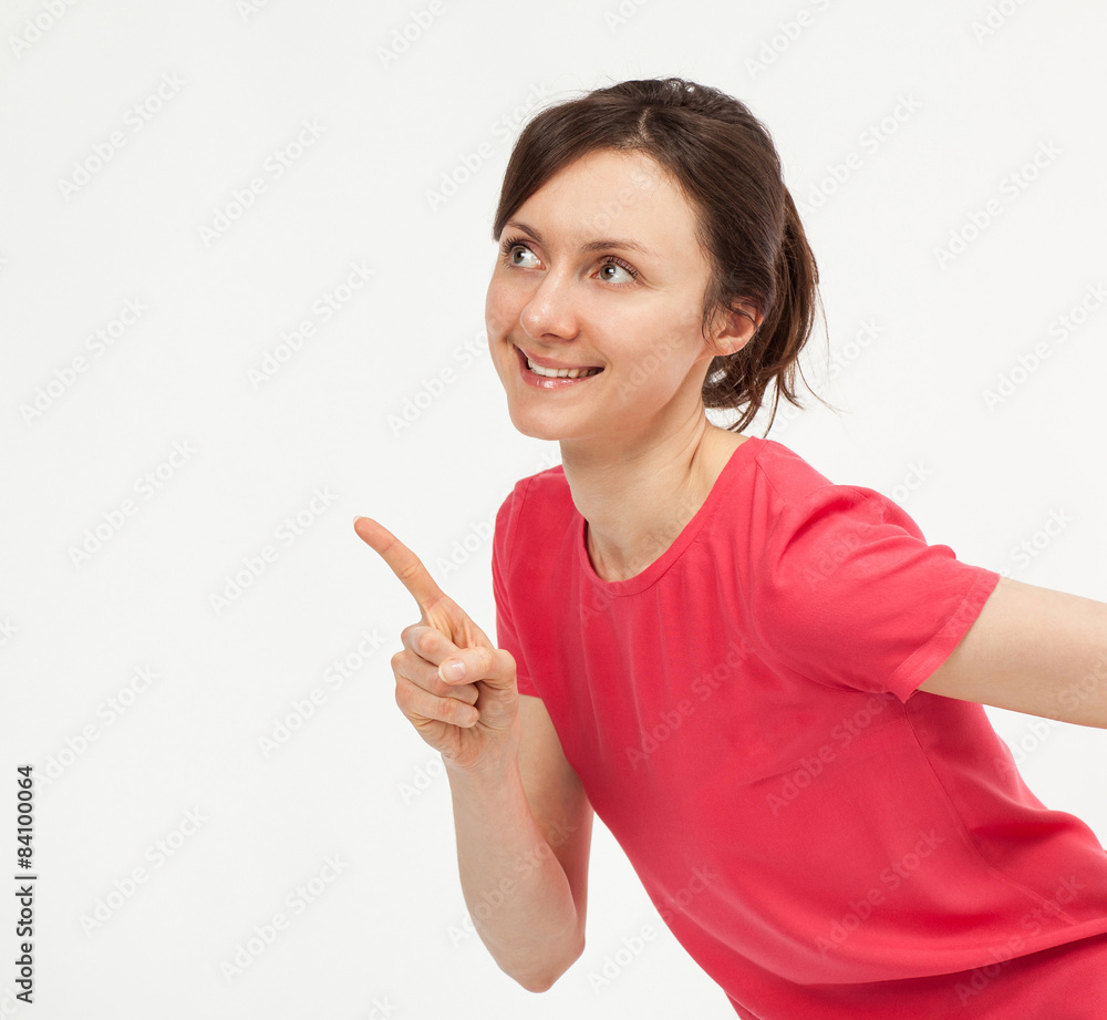 Attractive young woman pointing up Attractive young woman pointing up