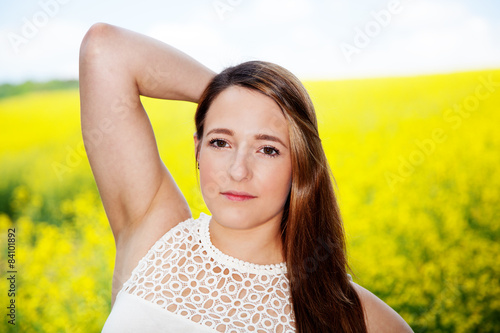 Woman posing in rape field