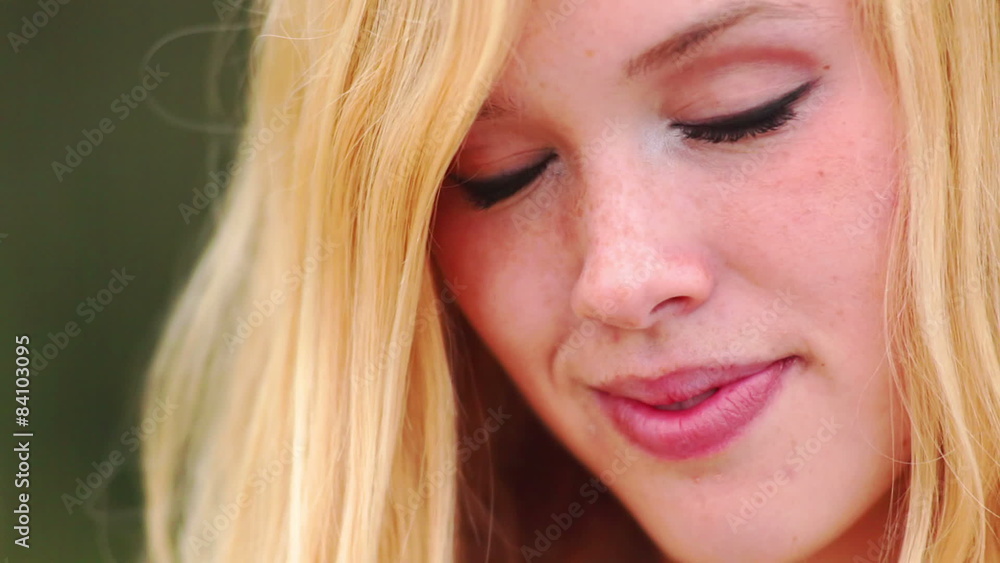 Attractive young woman smiles into the camera. Attractive young woman smiles into the camera.