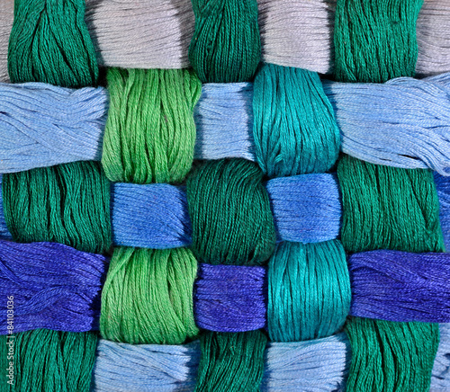 Colorful twisted skeins of floss as background texture