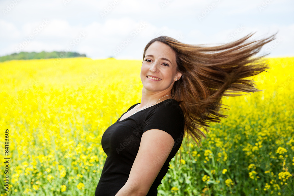 Woman with long brown hair in nature Woman with long brown hair in nature