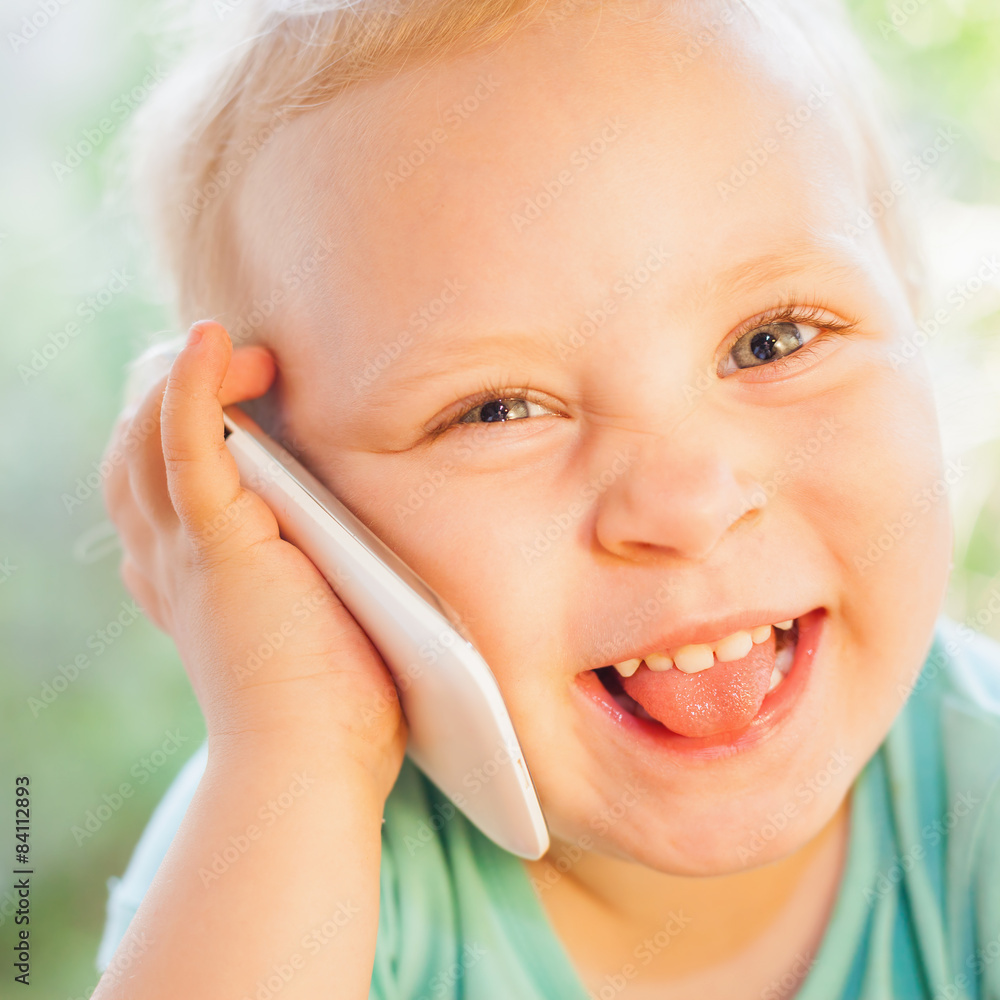 beautiful little child talking by mobile phone with her mother beautiful little child talking by mobile phone with her mother