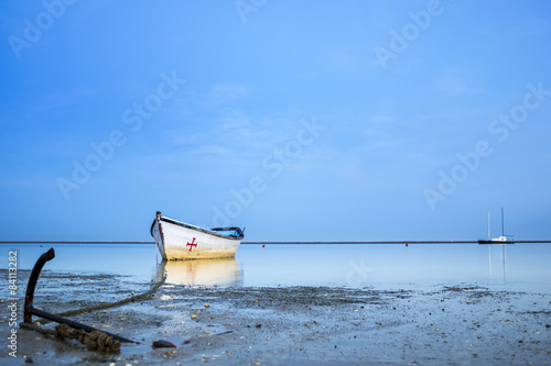 Boats in Ria Formosa wetlands landscape, Algarve.