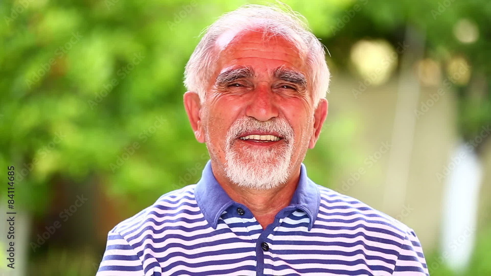 portrait smiling senior man in a garden portrait smiling senior man in a garden
