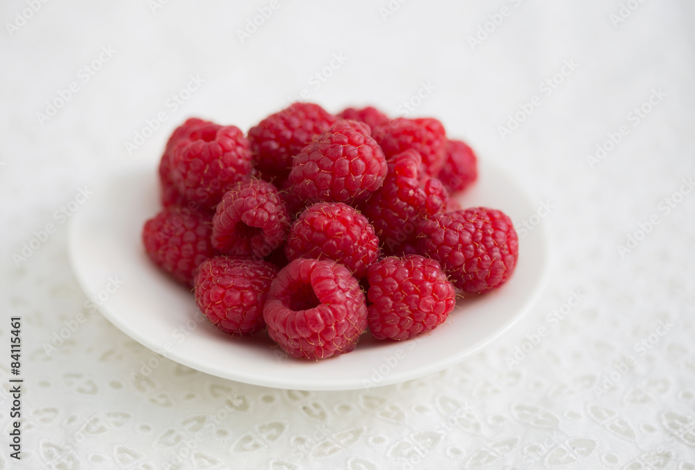 raspberry on the white plate raspberry on the white plate