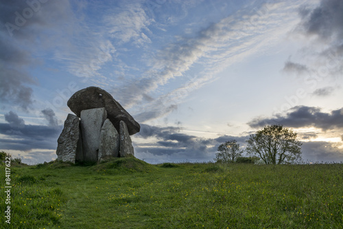 Trethevy Quoit, Cornwall, UK at sunset with blue sky and clouds