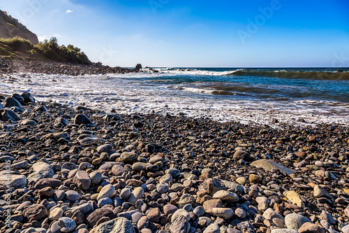 Stone beach on coast of ocean