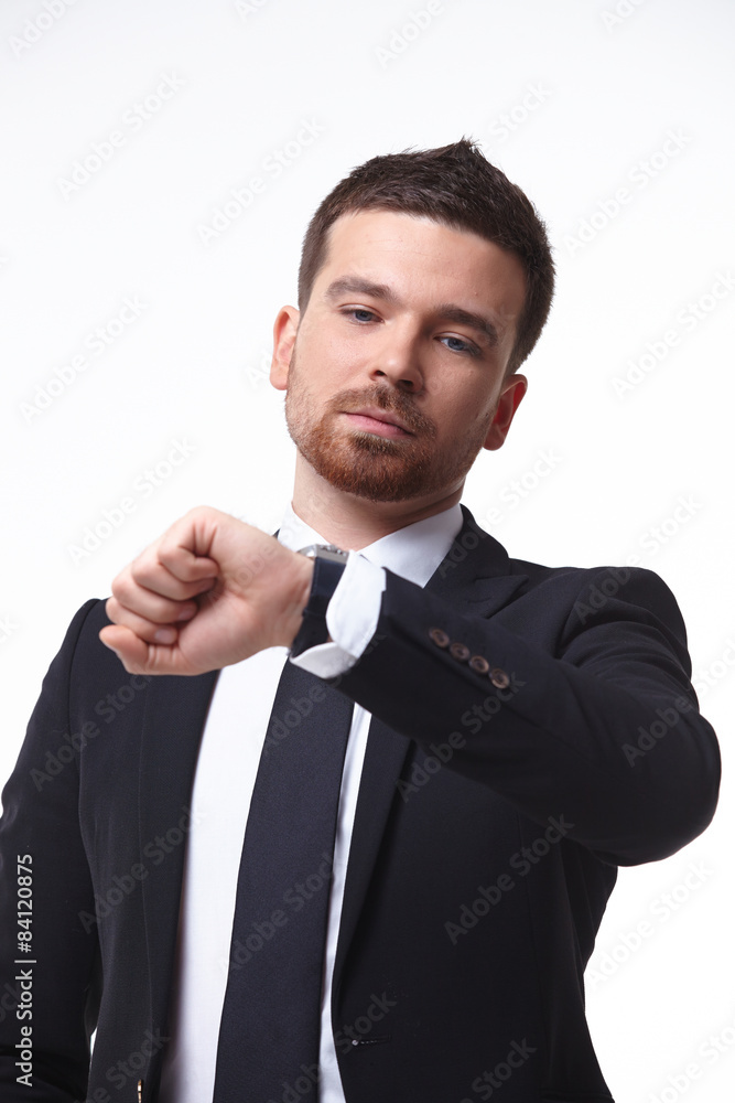 businessman looks at the clock businessman looks at the clock