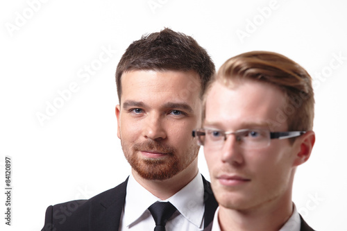 close-up portrait of two young businessmen