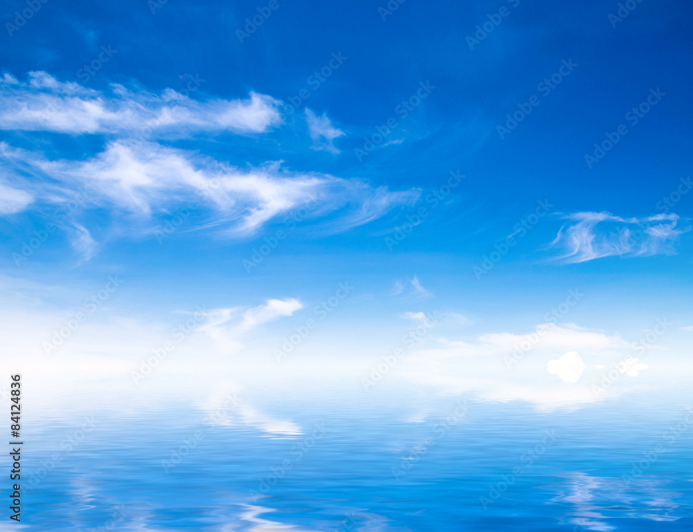 white fluffy clouds with rainbow in the blue sky white fluffy clouds with rainbow in the blue sky