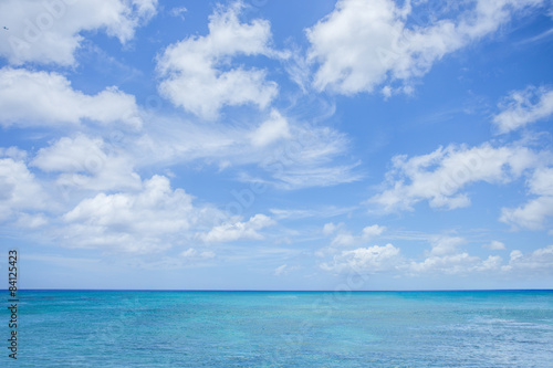Sea with clouds blue sky background