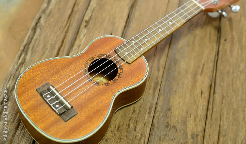 Close up ukuleles on wooden background. Close up ukuleles on wooden background.