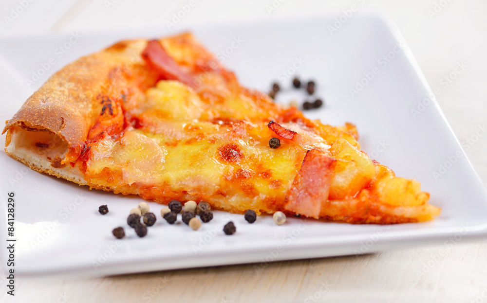 Delicious italian pizza served on white plate Delicious italian pizza served on white plate