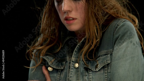 A  young white woman is cold and shivering