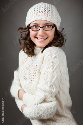 Portrait of a beautiful young smiling brunette wearing chochet h photo