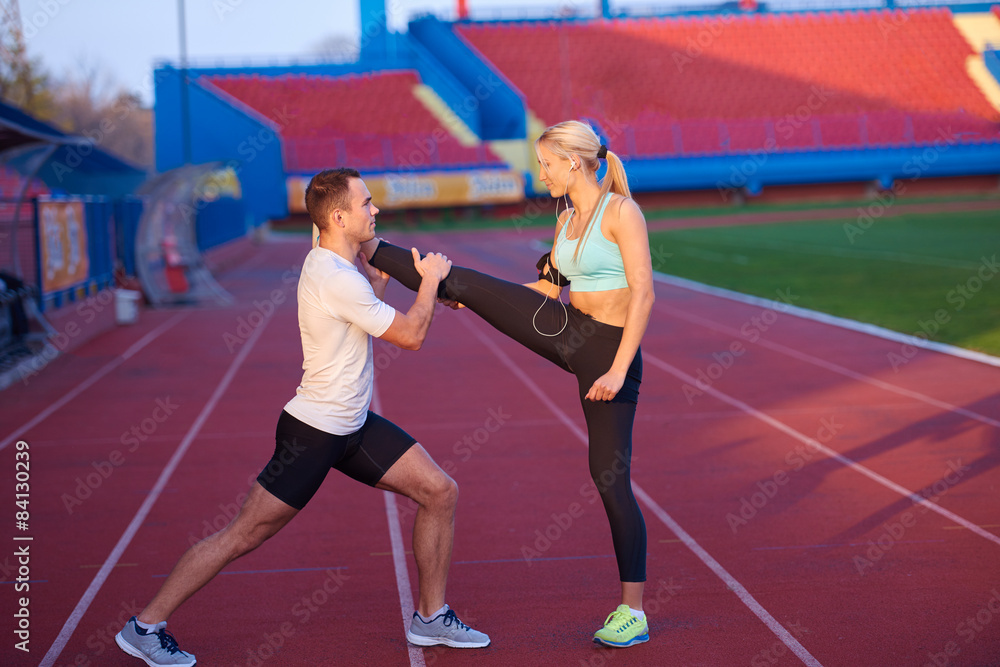 Obraz premium sporty woman on athletic race track