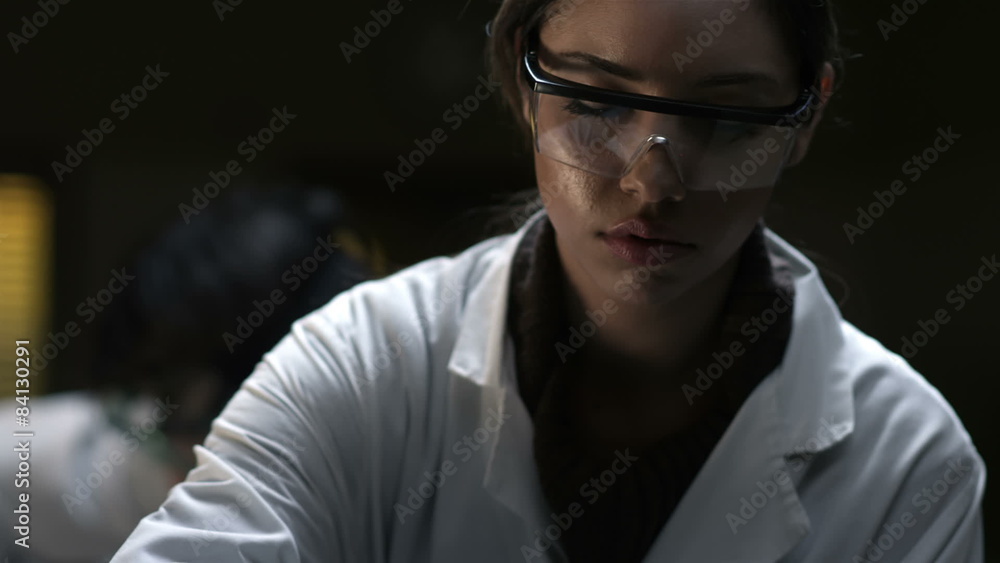 College students do experiments in a chemistry lab, close up College students do experiments in a chemistry lab, close up