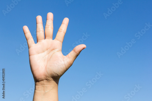 open hand on sky background