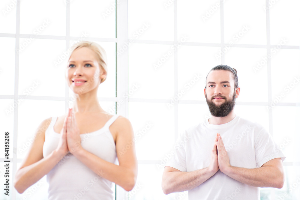 Fototapeta premium Yoga concept with young woman and man