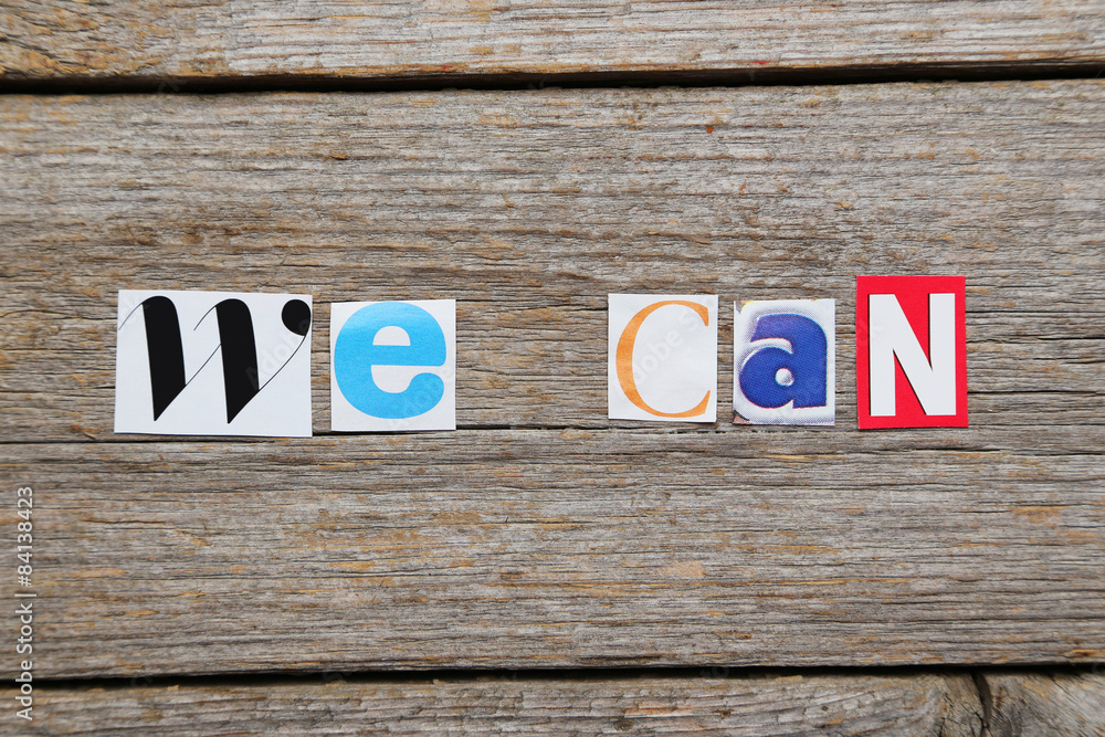 Fototapeta premium The word we can in cut out magazine letters