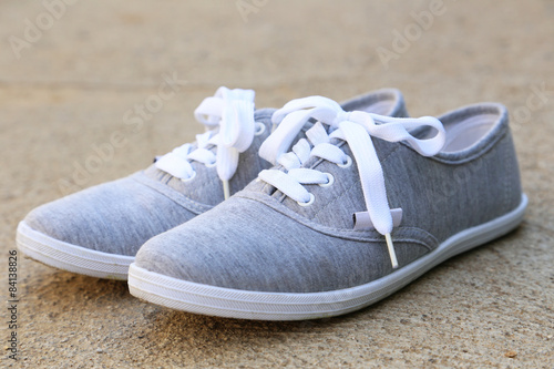 Pair of grey shoes outdoors