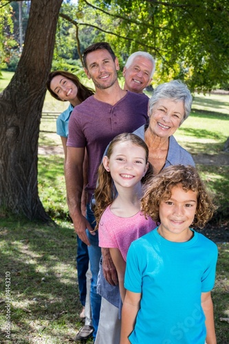Extended family smiling in the park © WavebreakmediaMicro