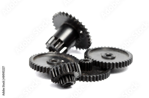Plastic gears of different sizes on a white background