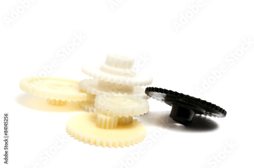 several small gears photographed close up on a white background