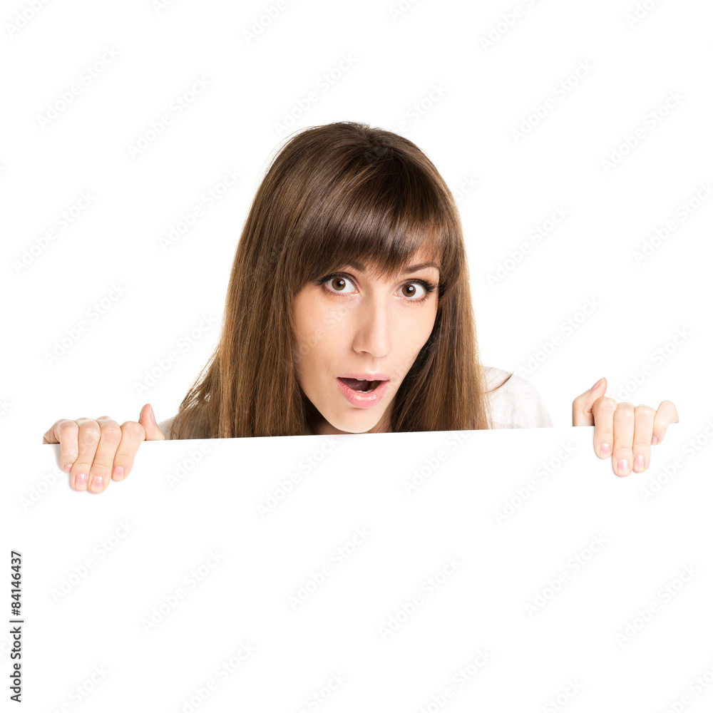 Young beautiful amazed woman holding blank white card Young beautiful amazed woman holding blank white card