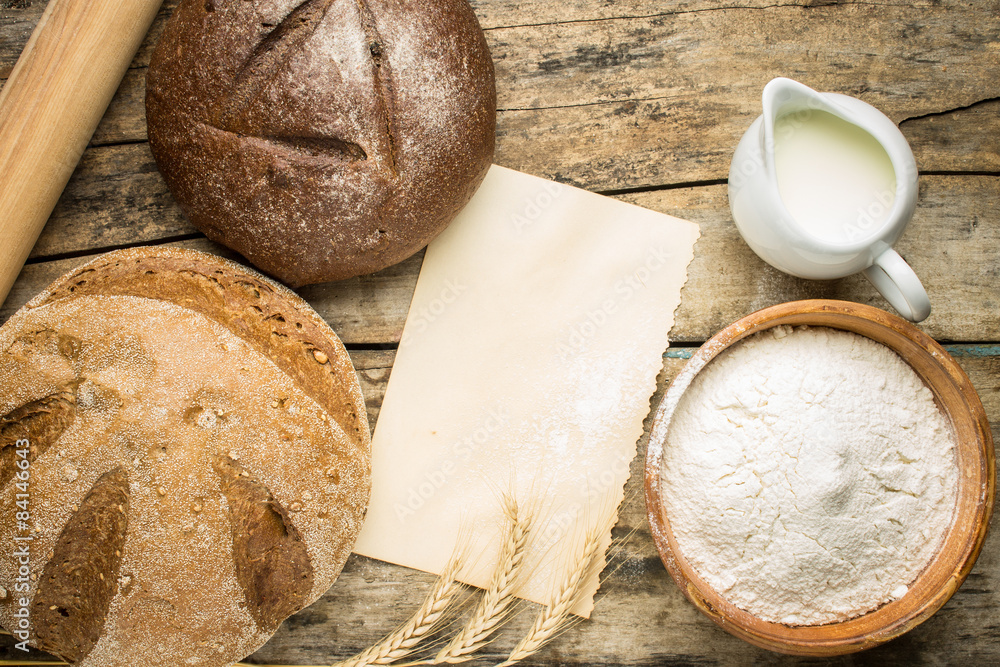 Bakery ingredients with fresh loaf of bread. Bakery ingredients with fresh loaf of bread.