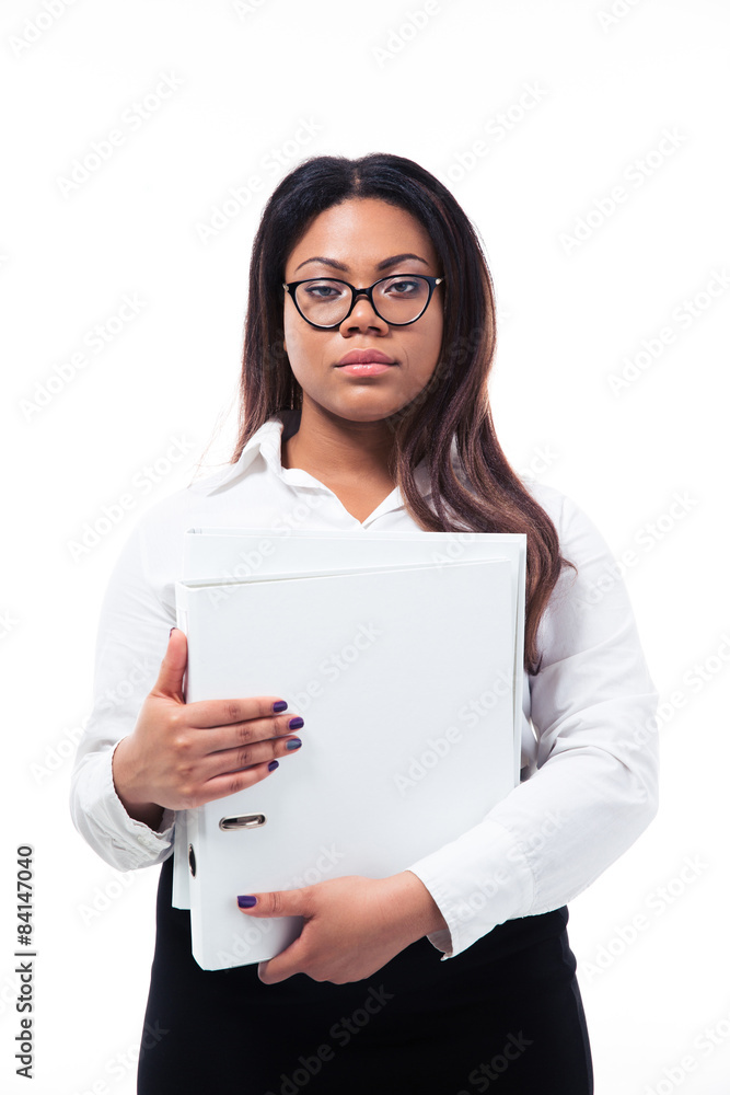 Serious businesswoman standing with folder Serious businesswoman standing with folder