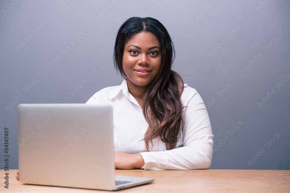 Businesswoman sitting at the table with laptop Businesswoman sitting at the table with laptop
