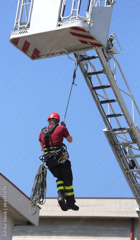 Fototapeta premium firefighter hung the rope climbing